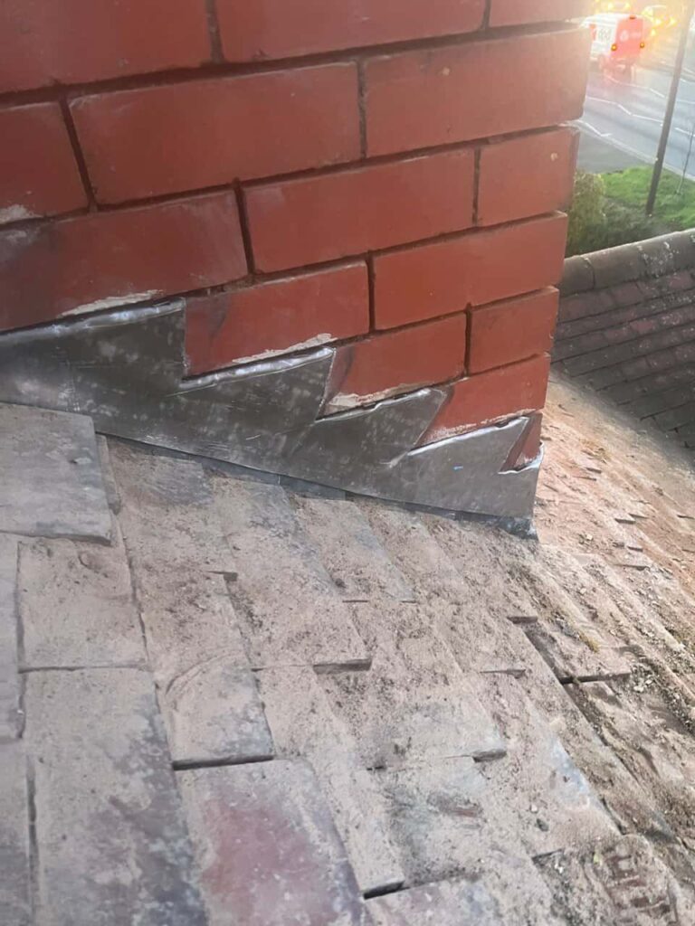 This is a photo of new leadwork being installed around an old chimney. Works carried out by Hayling Island Roofing Repairs
